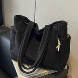 Edit – Ribbad toteväska med snodddetalj