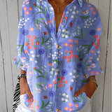 Josefin – Blommig blus med ängsdesign i lila